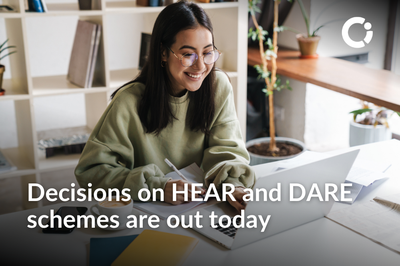 A smiling woman woman sits at a laptop and has a pen in hand. Text reads: 'Decisions on HEAR and DARE schemes are out today '